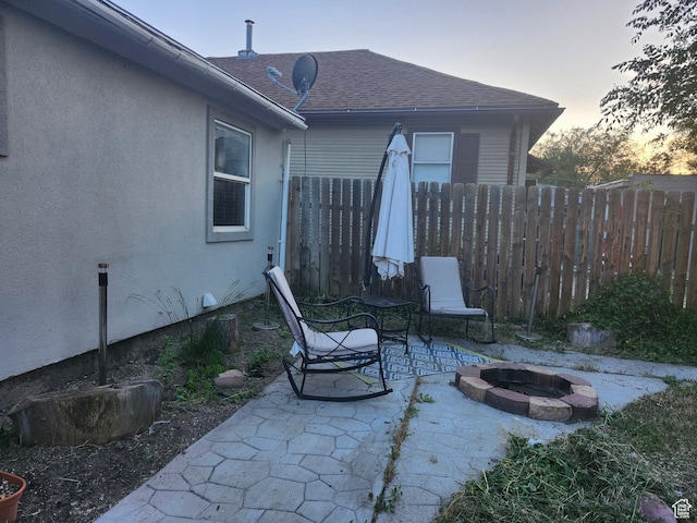 280 E Franklin St S, Ogden, UT 84401 - patio terrace at dusk with an outdoor fire pit and a patio