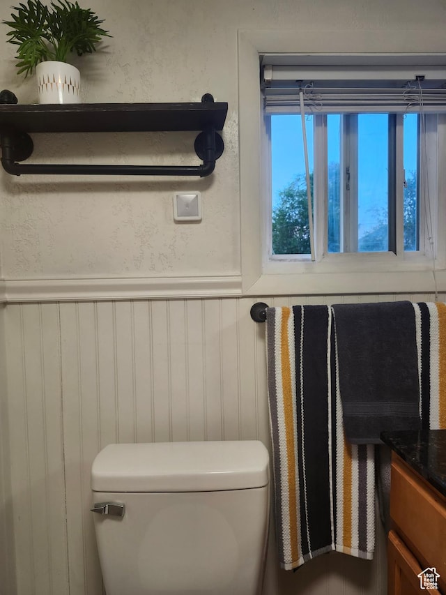 280 E Franklin St S, Ogden, UT 84401 - half bathroom with toilet and wainscoting