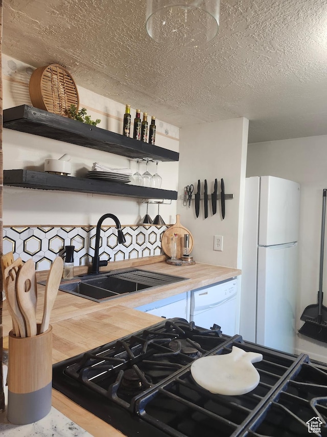 280 E Franklin St S, Ogden, UT 84401 - kitchen featuring white appliances, open shelves, wood finished floors, a textured ceiling, and light countertops