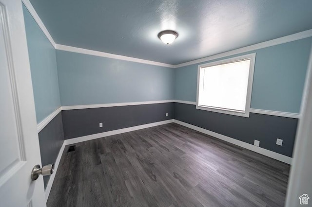 195 N 800 W, Cleveland, UT 84518 - unfurnished room featuring dark wood-style flooring and ornamental molding