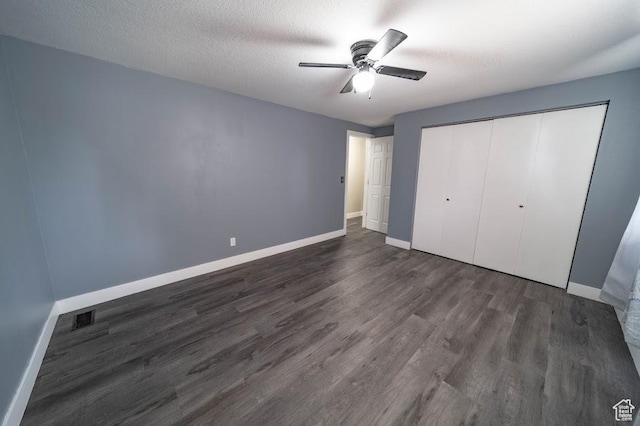 195 N 800 W, Cleveland, UT 84518 - unfurnished bedroom with dark wood-type flooring, a closet, and a ceiling fan