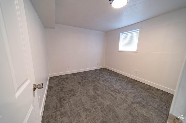 195 N 800 W, Cleveland, UT 84518 - empty room with baseboards and dark carpet