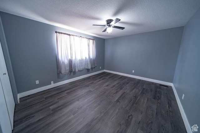 195 N 800 W, Cleveland, UT 84518 - spare room with a textured ceiling, ceiling fan, and dark wood-type flooring