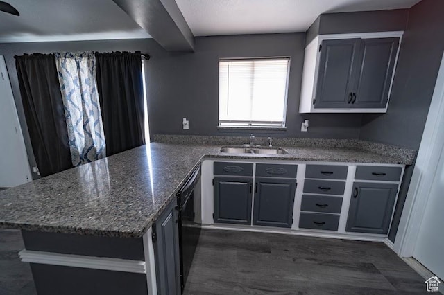 195 N 800 W, Cleveland, UT 84518 - kitchen featuring a peninsula, dark stone counters, dark wood-type flooring, and black dishwasher