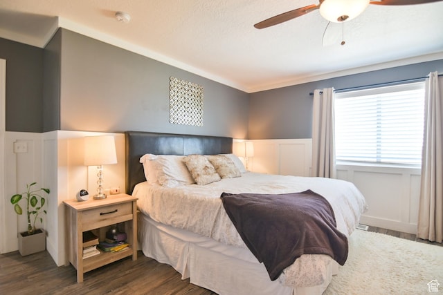 3319 N Falcon Way, Layton, UT 84040 - bedroom featuring wood finished floors, wainscoting, ceiling fan, and a decorative wall