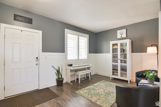 3319 N Falcon Way, Layton, UT 84040 - entrance foyer with a wainscoted wall, wood finished floors, and a decorative wall