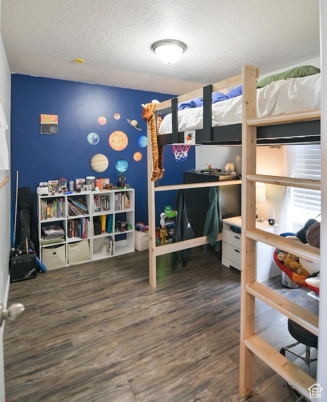 3319 N Falcon Way, Layton, UT 84040 - bedroom with wood finished floors and a textured ceiling