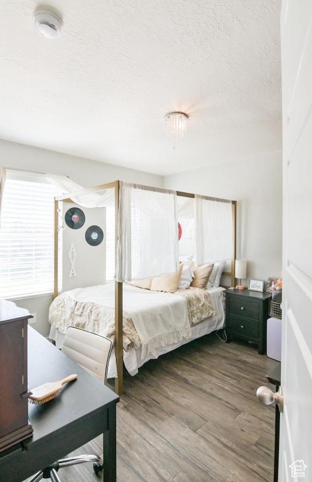 3319 N Falcon Way, Layton, UT 84040 - bedroom with a textured ceiling and wood finished floors