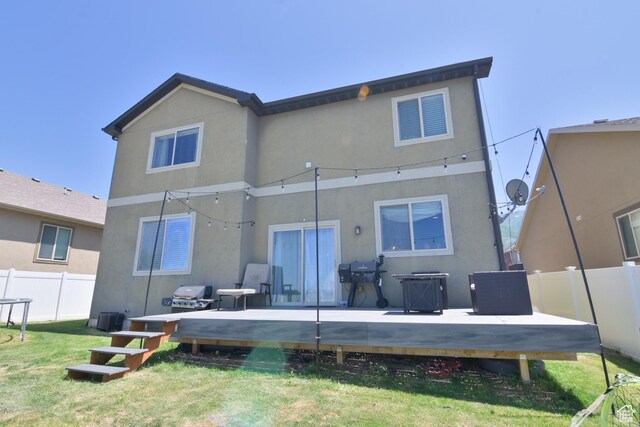 3319 N Falcon Way, Layton, UT 84040 - rear view of house featuring a wooden deck and stucco siding