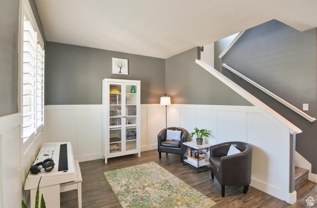 3319 N Falcon Way, Layton, UT 84040 - sitting room with stairs, a wainscoted wall, wood finished floors, and a decorative wall