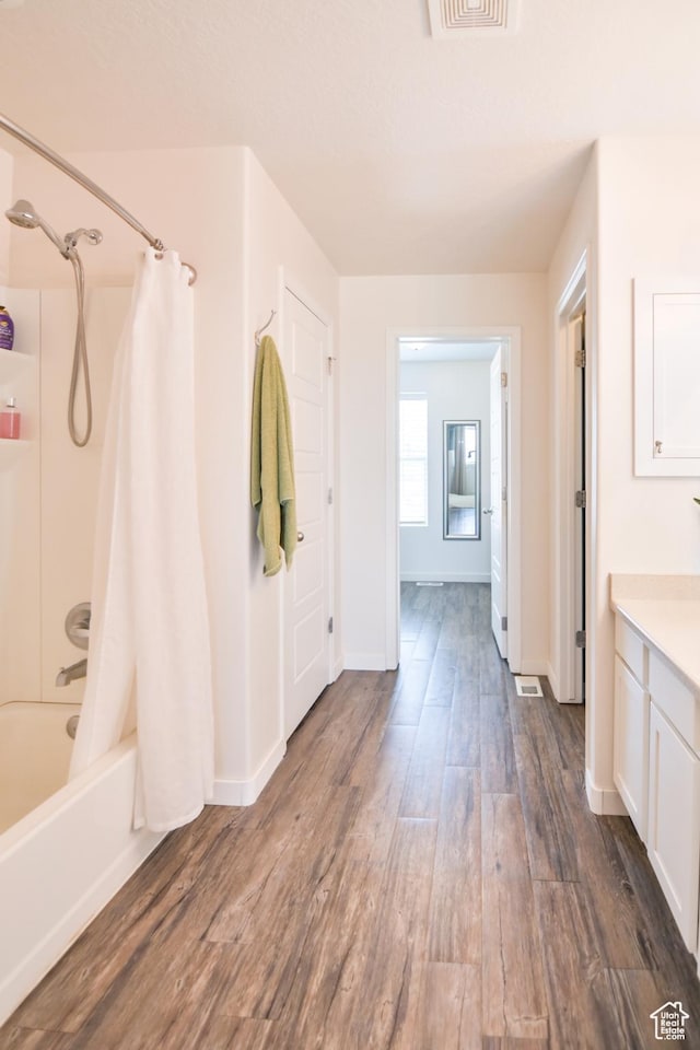 3319 N Falcon Way, Layton, UT 84040 - full bath featuring vanity, wood finished floors, and shower / tub combo