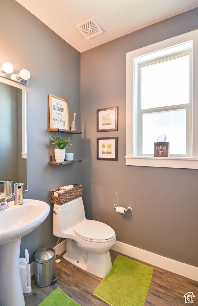 3319 N Falcon Way, Layton, UT 84040 - bathroom featuring wood finished floors and toilet