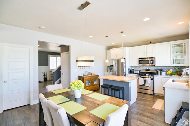 3319 N Falcon Way, Layton, UT 84040 - dining room featuring dark wood-type flooring, recessed lighting, and a wainscoted wall