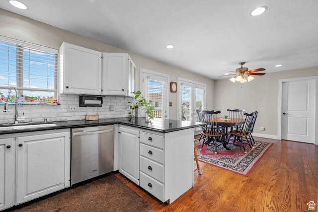 44 S 1000 E, Springville, UT 84663 - kitchen with stainless steel dishwasher, dark countertops, a peninsula, dark wood-style flooring, and recessed lighting