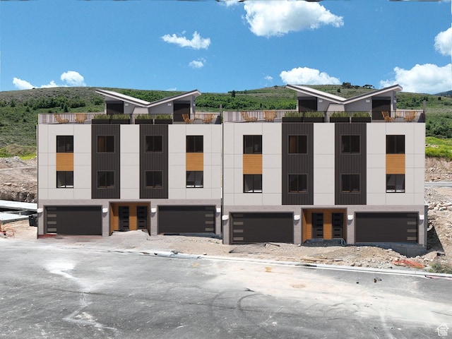 0, Garden City, UT 84028 - view of building exterior featuring a garage and a mountain view