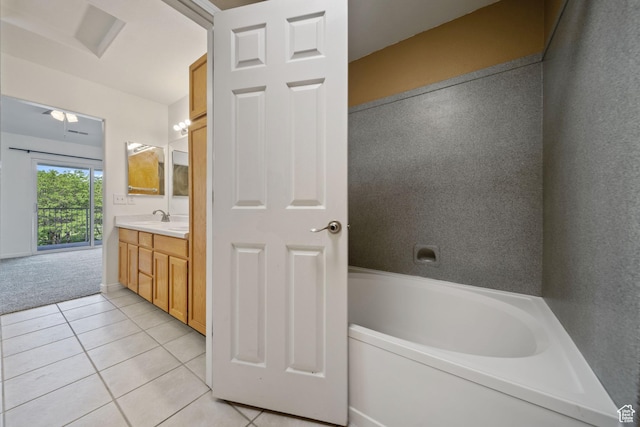 3807 S River Run Way Unit 3, Salt Lake City, UT 84119 - bathroom featuring tile patterned floors, vanity, a tub to relax in, and ceiling fan