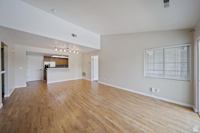 3807 S River Run Way Unit 3, Salt Lake City, UT 84119 - unfurnished living room featuring light wood-style flooring and track lighting