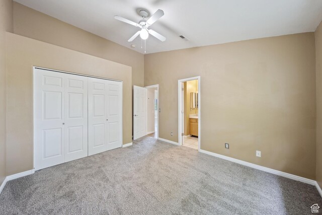 3807 S River Run Way Unit 3, Salt Lake City, UT 84119 - unfurnished bedroom featuring light carpet, a closet, vaulted ceiling, a ceiling fan, and connected bathroom