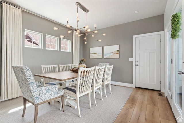 5057 W Bowstring Way S, South Jordan, UT 84009 - dining space with a chandelier and light wood-style flooring