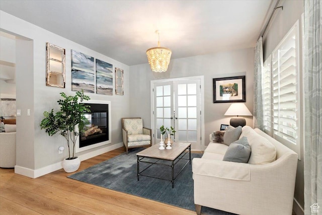 5057 W Bowstring Way S, South Jordan, UT 84009 - living room with wood finished floors, plenty of natural light, french doors, and a chandelier