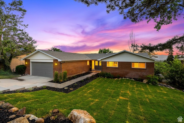 8816 S Alpen Way E, Cottonwood Heights, UT 84121 - ranch-style home with brick siding, concrete driveway, an attached garage, and a yard