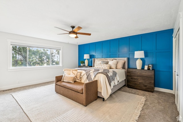 8816 S Alpen Way E, Cottonwood Heights, UT 84121 - carpeted bedroom with a decorative wall and a ceiling fan