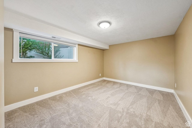8816 S Alpen Way E, Cottonwood Heights, UT 84121 - spare room featuring carpet flooring and a textured ceiling