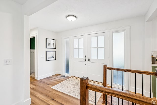 8816 S Alpen Way E, Cottonwood Heights, UT 84121 - foyer with baseboards and light wood-style flooring