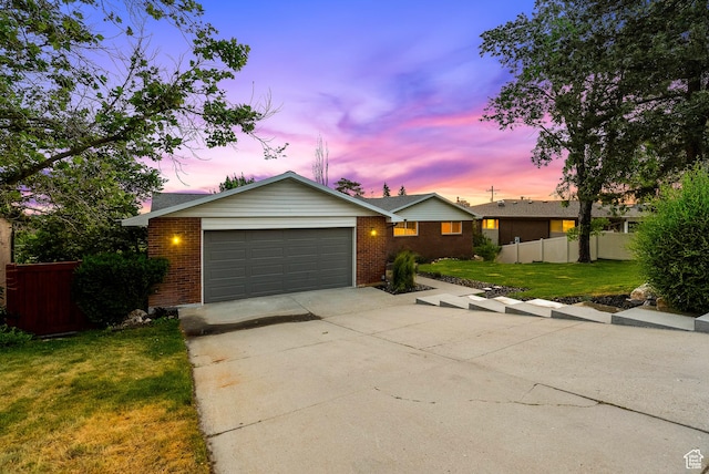 8816 S Alpen Way E, Cottonwood Heights, UT 84121 - ranch-style home with brick siding, driveway, and a garage