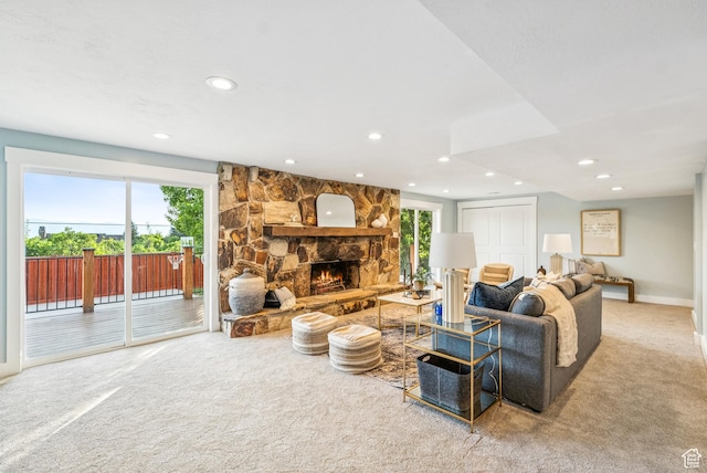 8816 S Alpen Way E, Cottonwood Heights, UT 84121 - carpeted living room with healthy amount of natural light, recessed lighting, and a stone fireplace