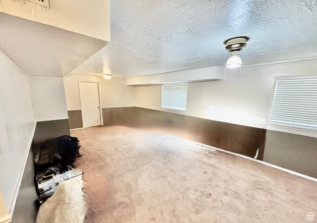 4946 W Pawnee Dr, West Jordan, UT 84081 - spare room with a textured ceiling and carpet