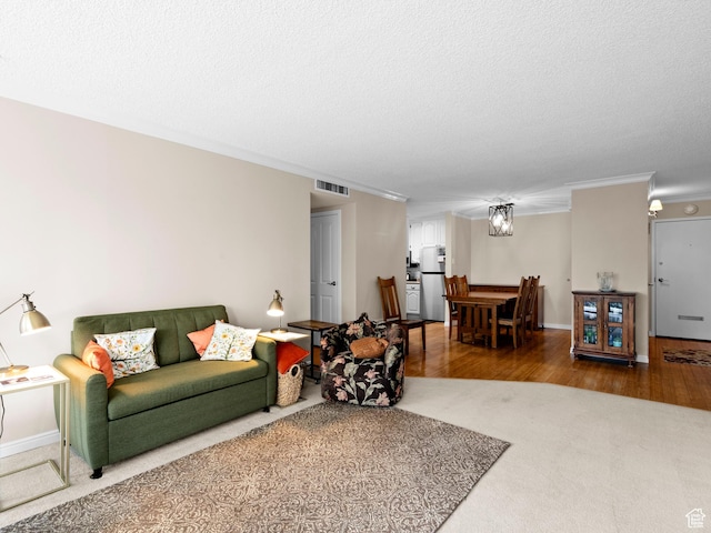 123 E 2nd Ave Unit 502, Salt Lake City, UT 84103 - carpeted living room with ornamental molding, wood finished floors, and a textured ceiling