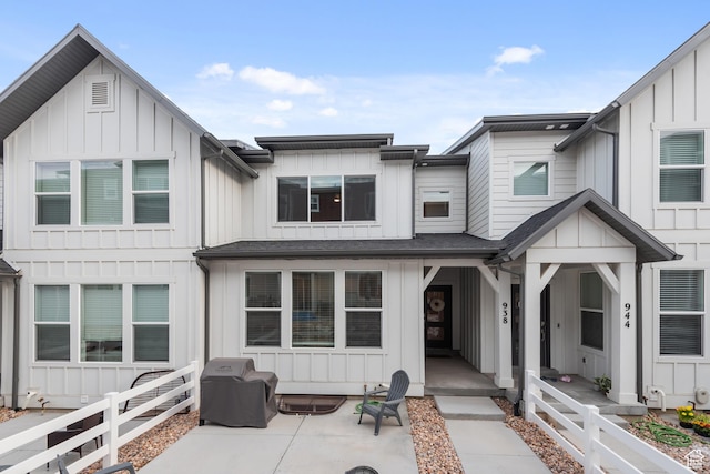 938 W Terracotta Dr, Saratoga Springs, UT 84045 - view of front of home with board and batten siding and a patio