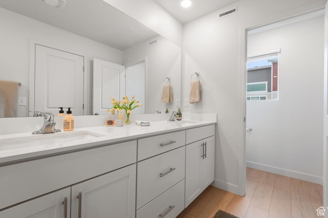 938 W Terracotta Dr, Saratoga Springs, UT 84045 - bathroom with double vanity and wood finished floors