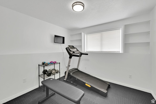 874 W 1145 N, Clinton, UT 84015 - workout room with baseboards and a textured ceiling