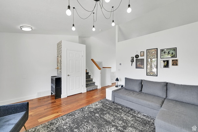 874 W 1145 N, Clinton, UT 84015 - living area featuring stairway, wood finished floors, and a chandelier