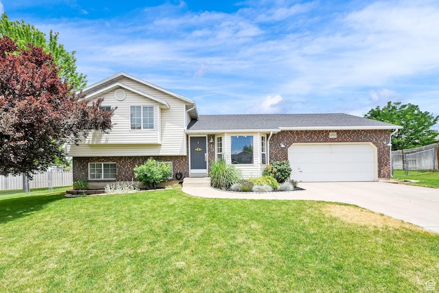 874 W 1145 N, Clinton, UT 84015 - tri-level home featuring brick siding, a garage, and concrete driveway