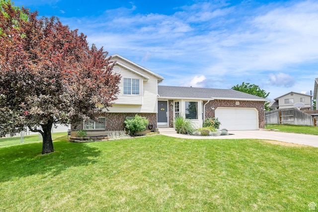 874 W 1145 N, Clinton, UT 84015 - tri-level home with brick siding, a garage, and driveway