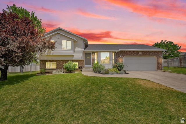 874 W 1145 N, Clinton, UT 84015 - split level home with brick siding, an attached garage, and concrete driveway