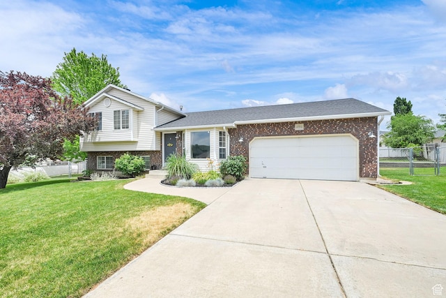 874 W 1145 N, Clinton, UT 84015 - tri-level home with brick siding, an attached garage, concrete driveway, and roof with shingles