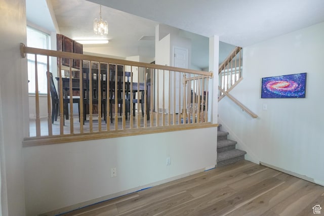 1782 W Alps Way, Salt Lake City, UT 84116 - stairway with wood finished floors and a chandelier