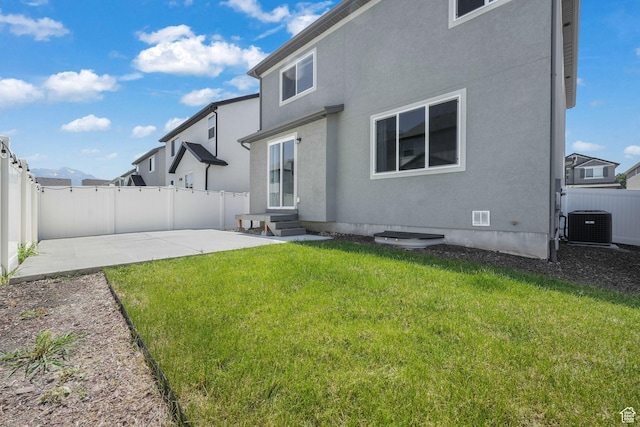 1666 W Rockaway Ln, West Jordan, UT 84084 - rear view of house with entry steps, a fenced backyard, and a patio