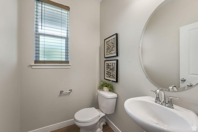 1666 W Rockaway Ln, West Jordan, UT 84084 - half bathroom featuring a sink and baseboards