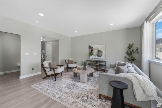1666 W Rockaway Ln, West Jordan, UT 84084 - living room with light wood finished floors and recessed lighting