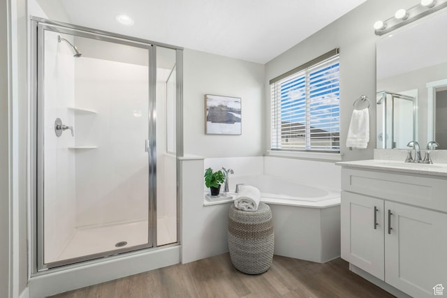 1666 W Rockaway Ln, West Jordan, UT 84084 - bathroom with a stall shower, vanity, wood finished floors, and a garden tub
