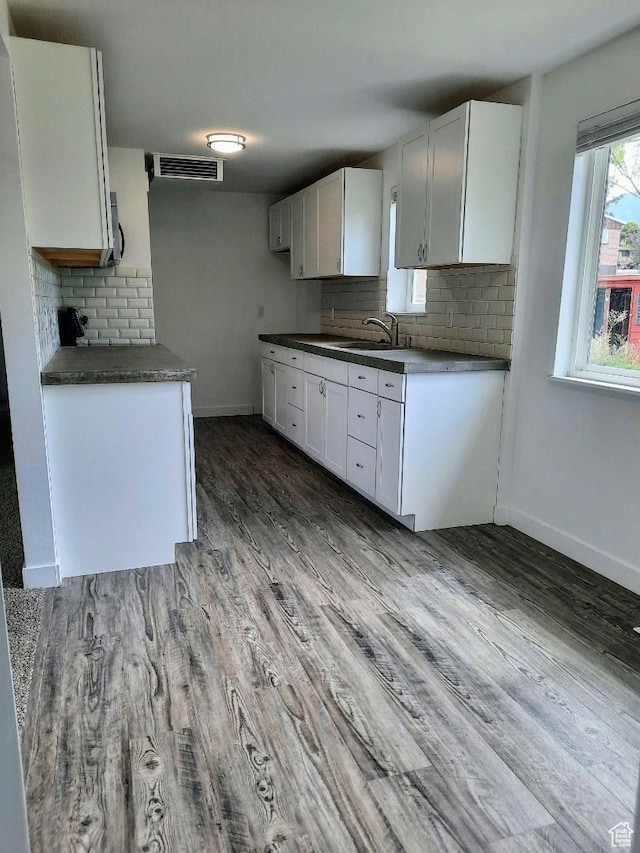 1018 E 40 N, Springville, UT 84663 - kitchen with decorative backsplash, wood finished floors, white cabinets, and dark countertops