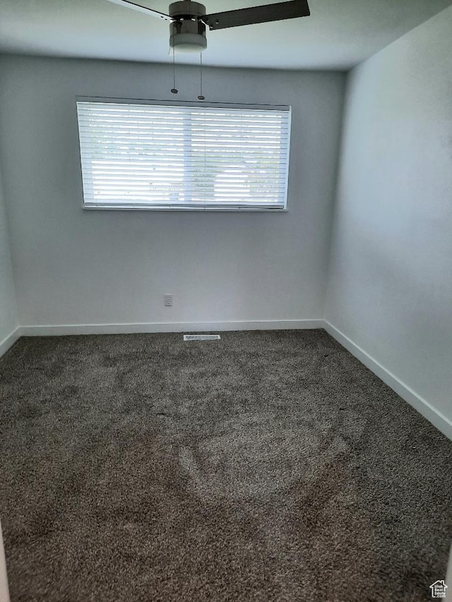 1018 E 40 N, Springville, UT 84663 - unfurnished room featuring healthy amount of natural light, dark colored carpet, and a ceiling fan