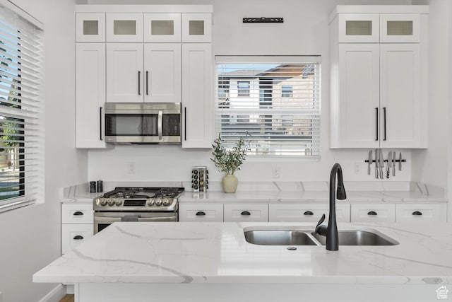 3547 N Creekside Way, Eden, UT 84310 - kitchen with stainless steel appliances, white cabinets, and glass insert cabinets