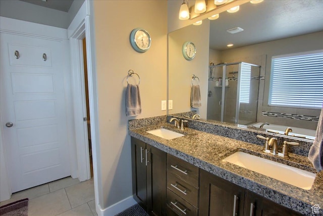 342 E Chiswick Ct, Stansbury Park, UT 84074 - full bathroom with tile patterned flooring, a stall shower, a garden tub, and double vanity