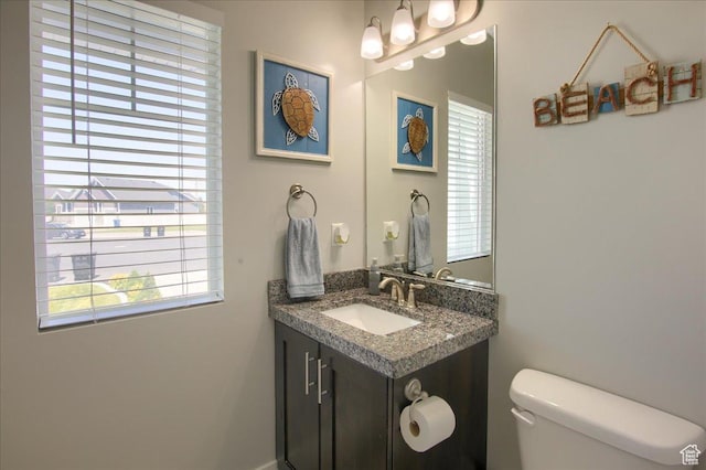 342 E Chiswick Ct, Stansbury Park, UT 84074 - half bath featuring plenty of natural light and vanity